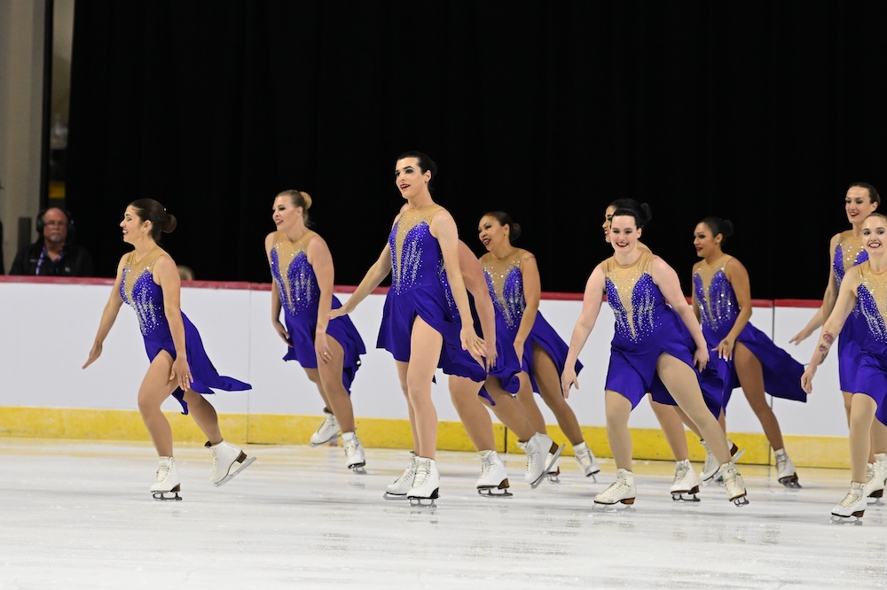 Brooke with her team as they begin to separate to do another synchronized skating element.
