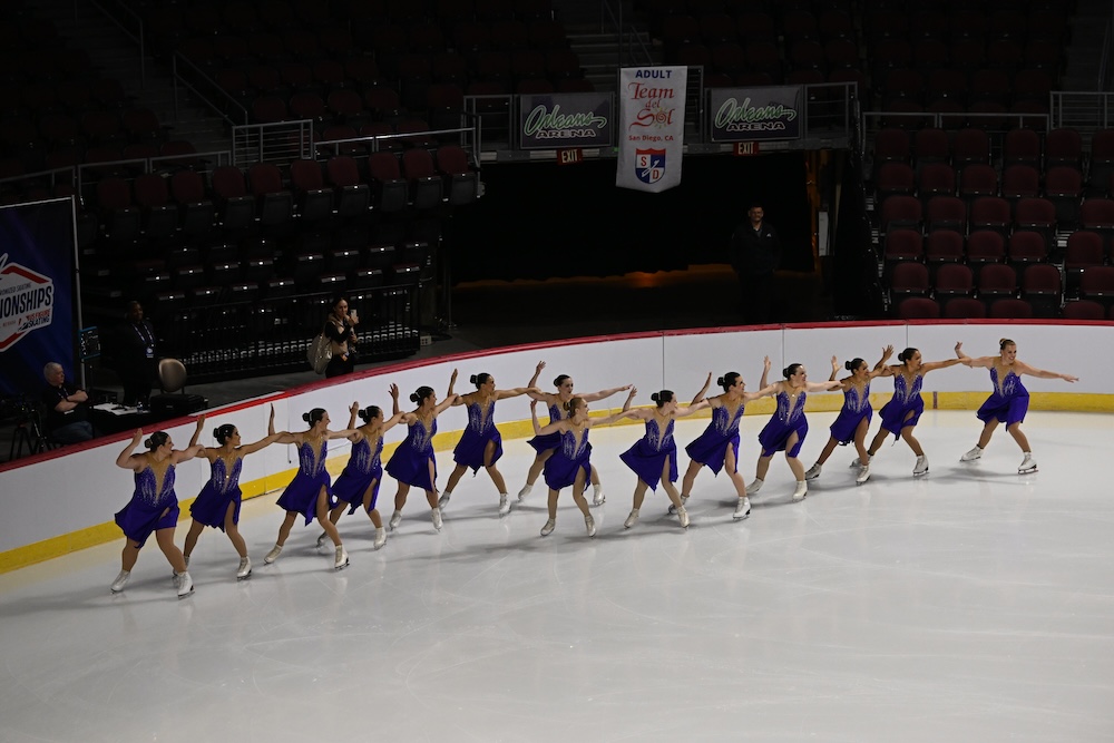 Brooke with her team as they skate in three lines as they prepare for another synchronized skating element.
