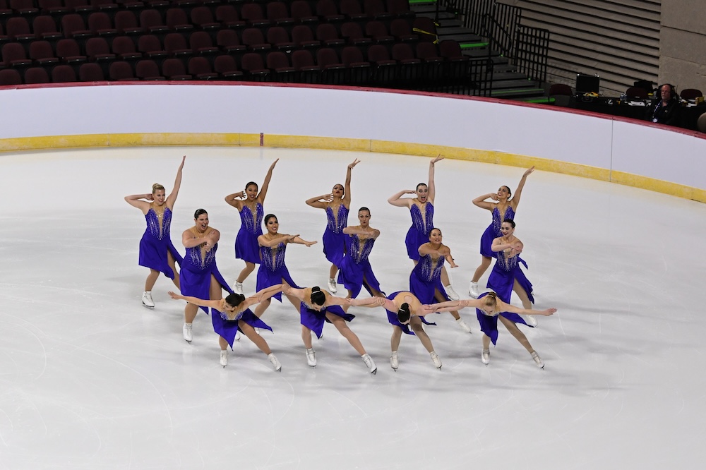 Brooke with her team as they do an artistic flair at the end of a synchronized skating element.